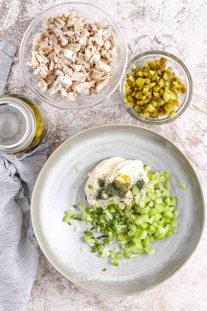 mixing the dressing ingredients for dill pickle chicken salad