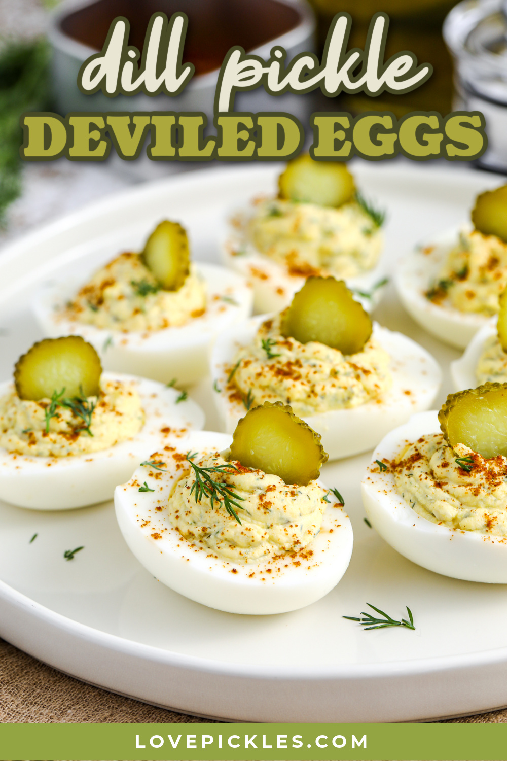 dill pickle deviled eggs on a platter with text.