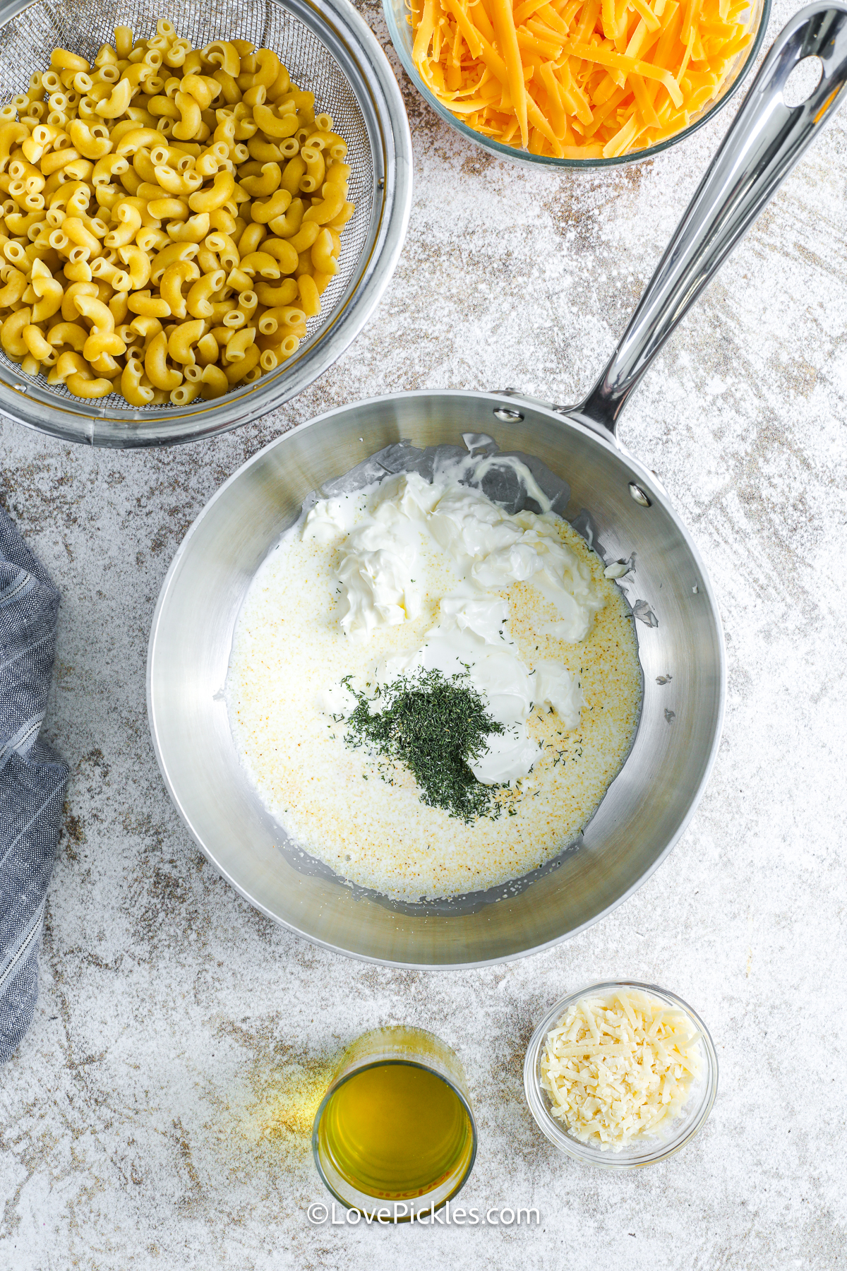 mixing ingredients in a pot for dill pickle mac and cheese