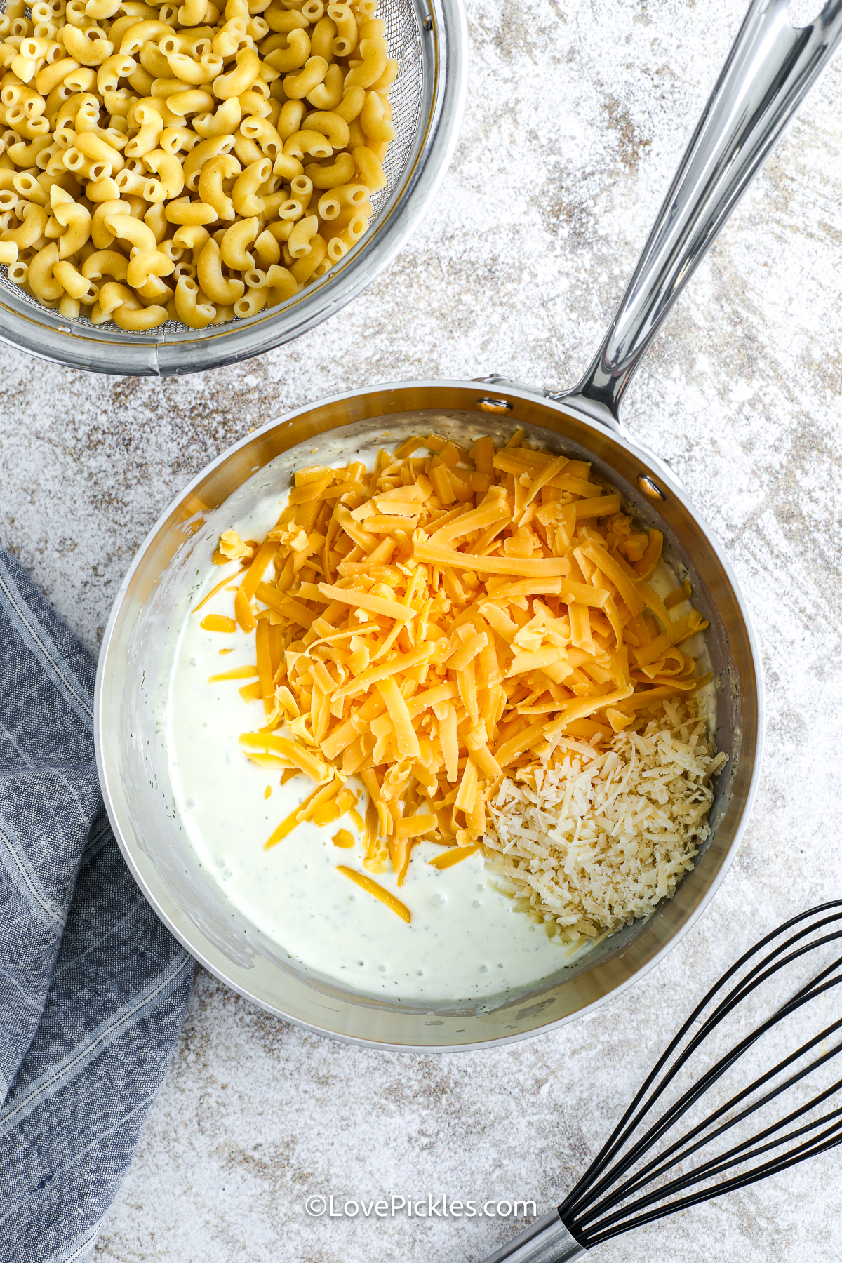 cheese added to pot to make dill pickle mac and cheese