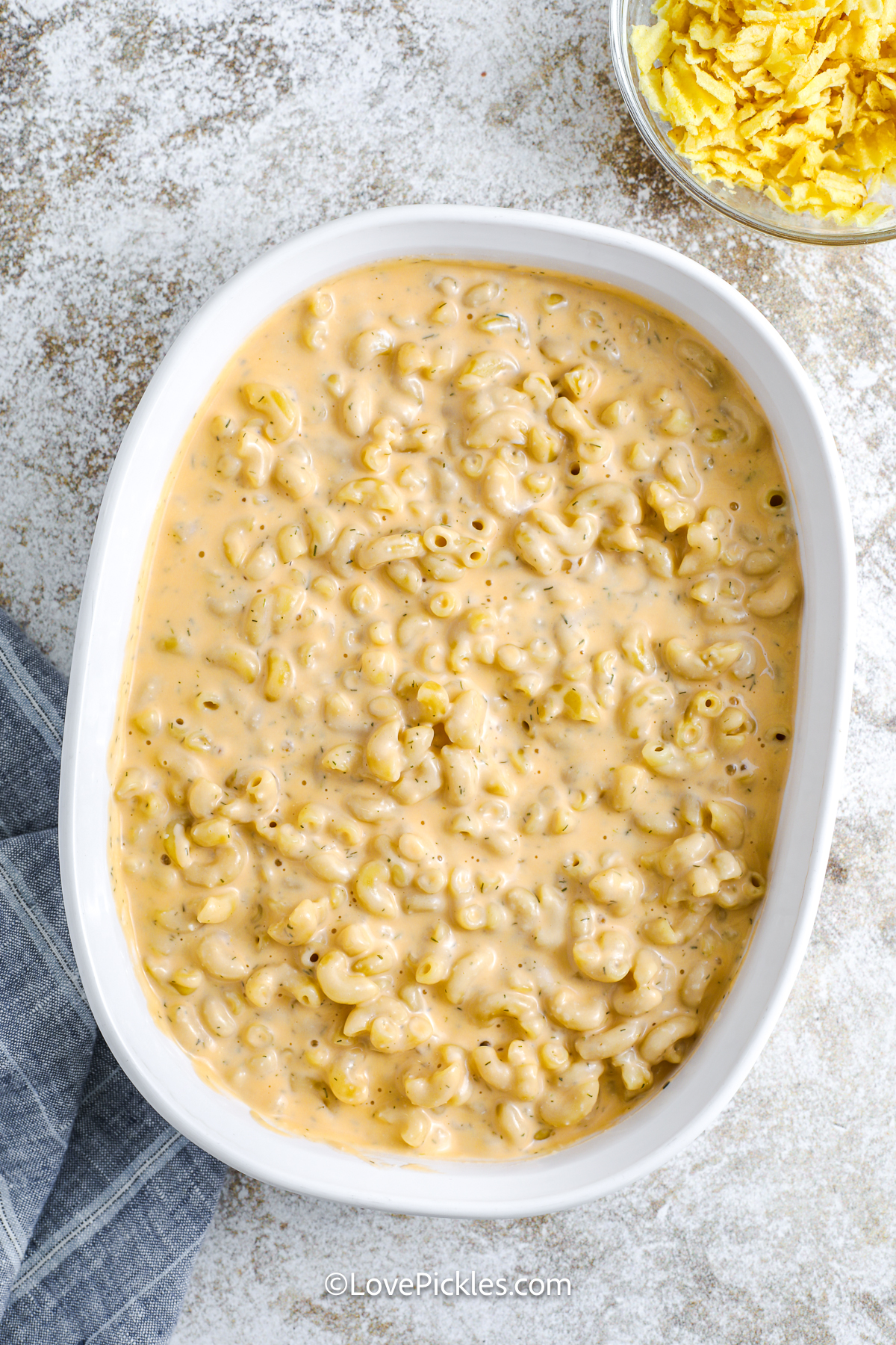 unbaked dill pickle mac and cheese in a casserole dish