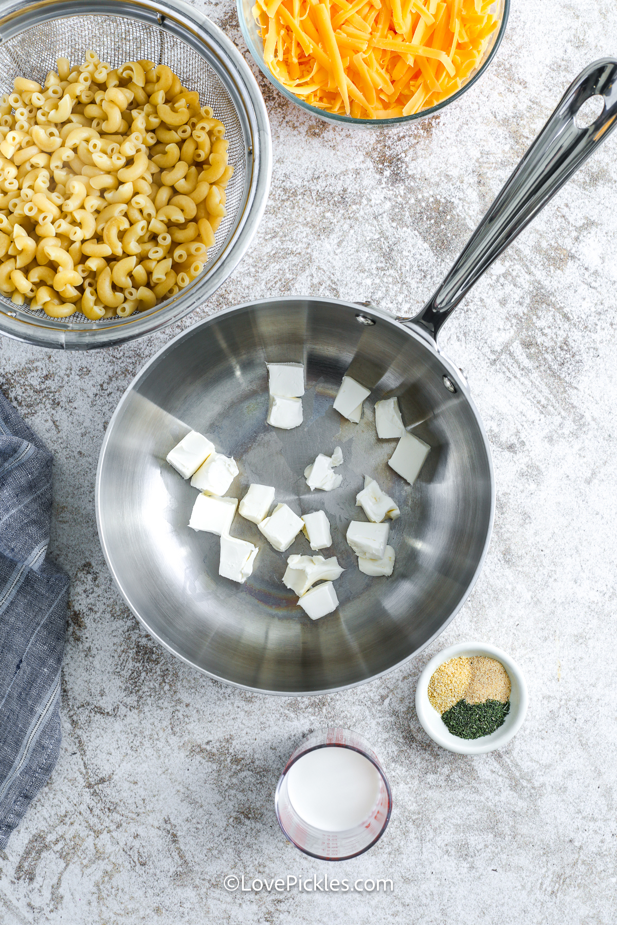 ingredients for dill pickle mac and cheese ready to be added to a pot.