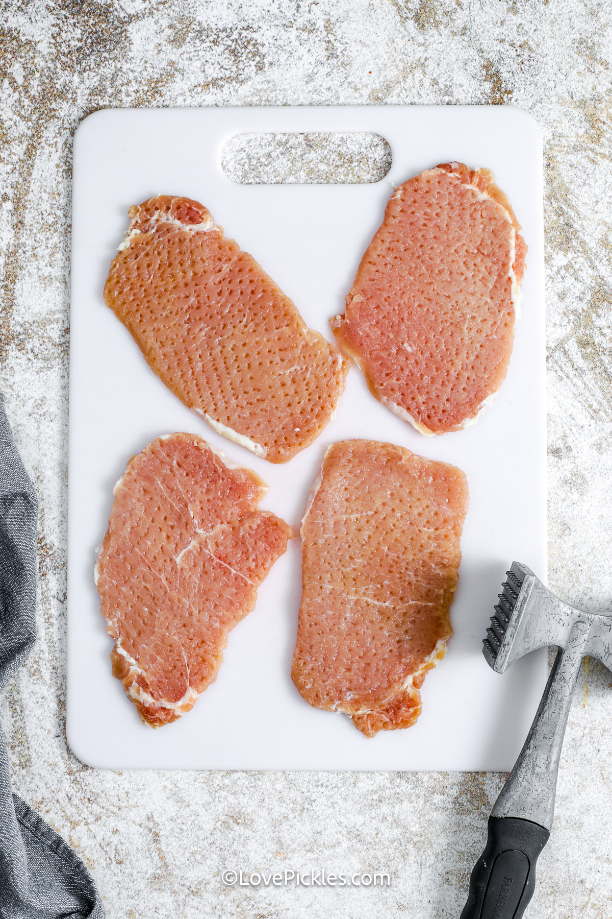 pork chops pounded with a mallet to make dill pickle schnitzel