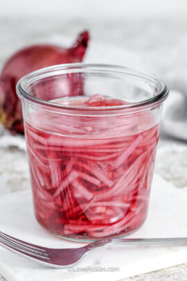 pickled red onions in a jar