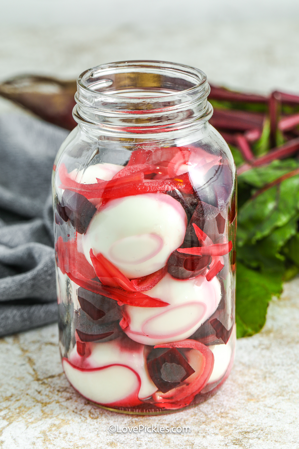 eggs, onion, and beets in a jar