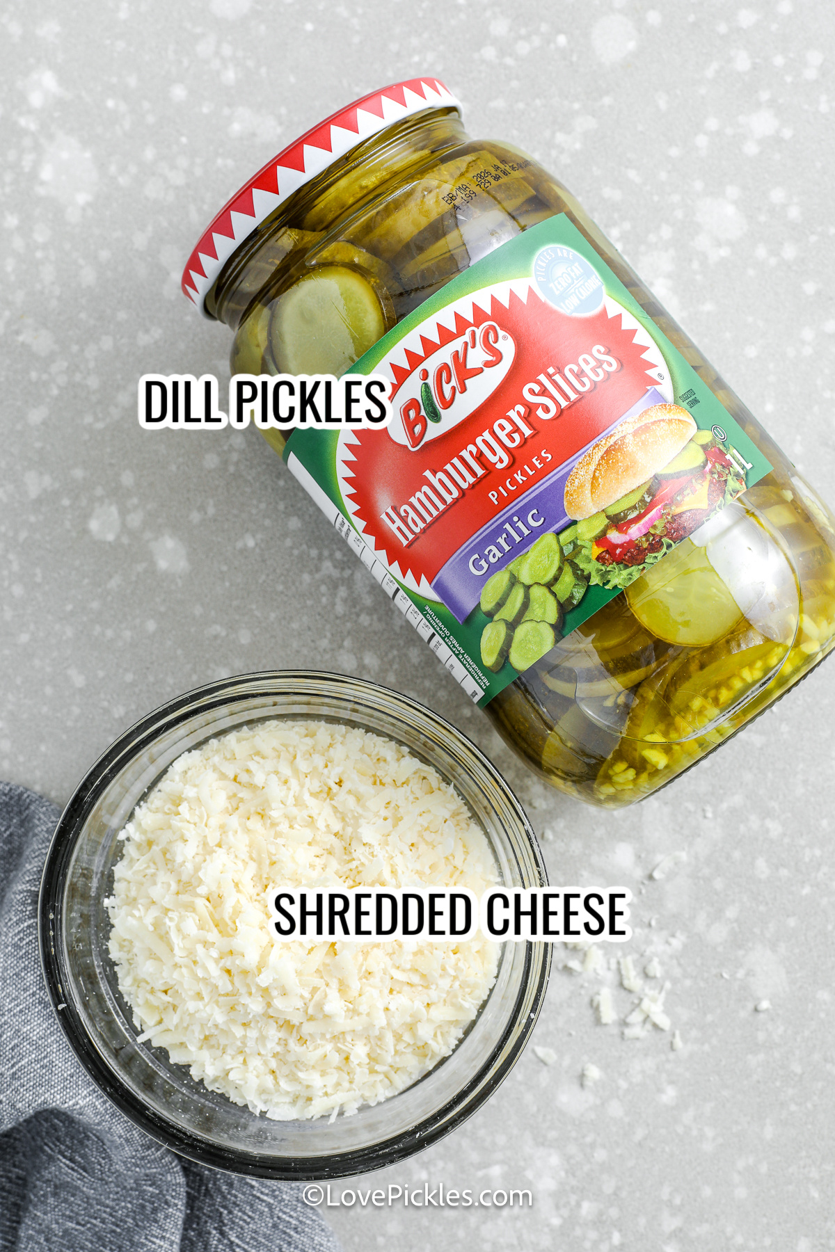 ingredients with labels to make cheese pickle chips including shredded cheese and pickles