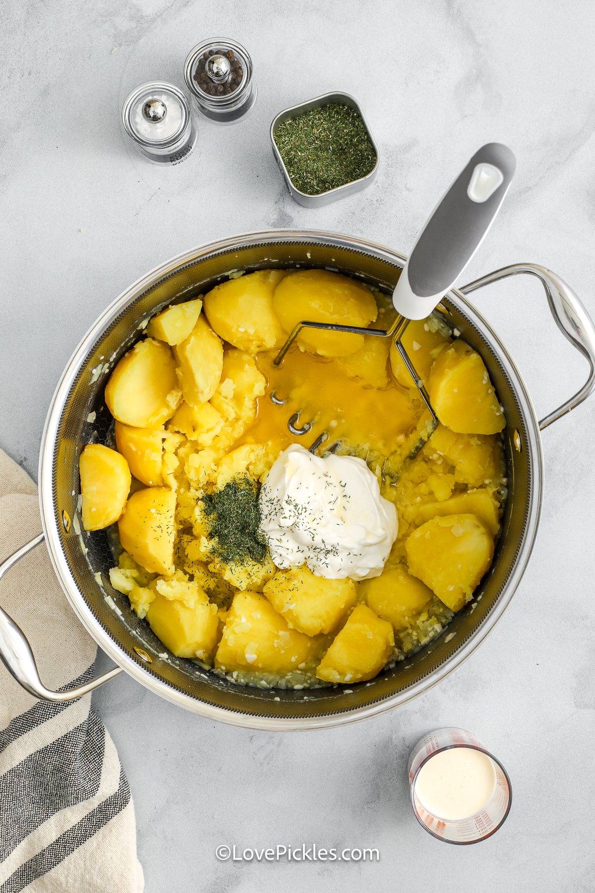 sour cream added to cooked poatoes to make dill pickle mashed potatoes