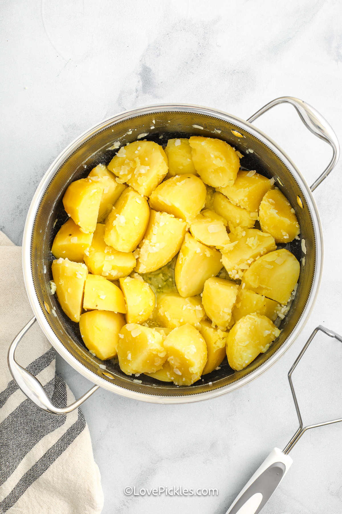 cooked and drained potatoes in a pot to make dill pickle mashed potatoes