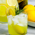viral dill pickle lemonade garnished with dill