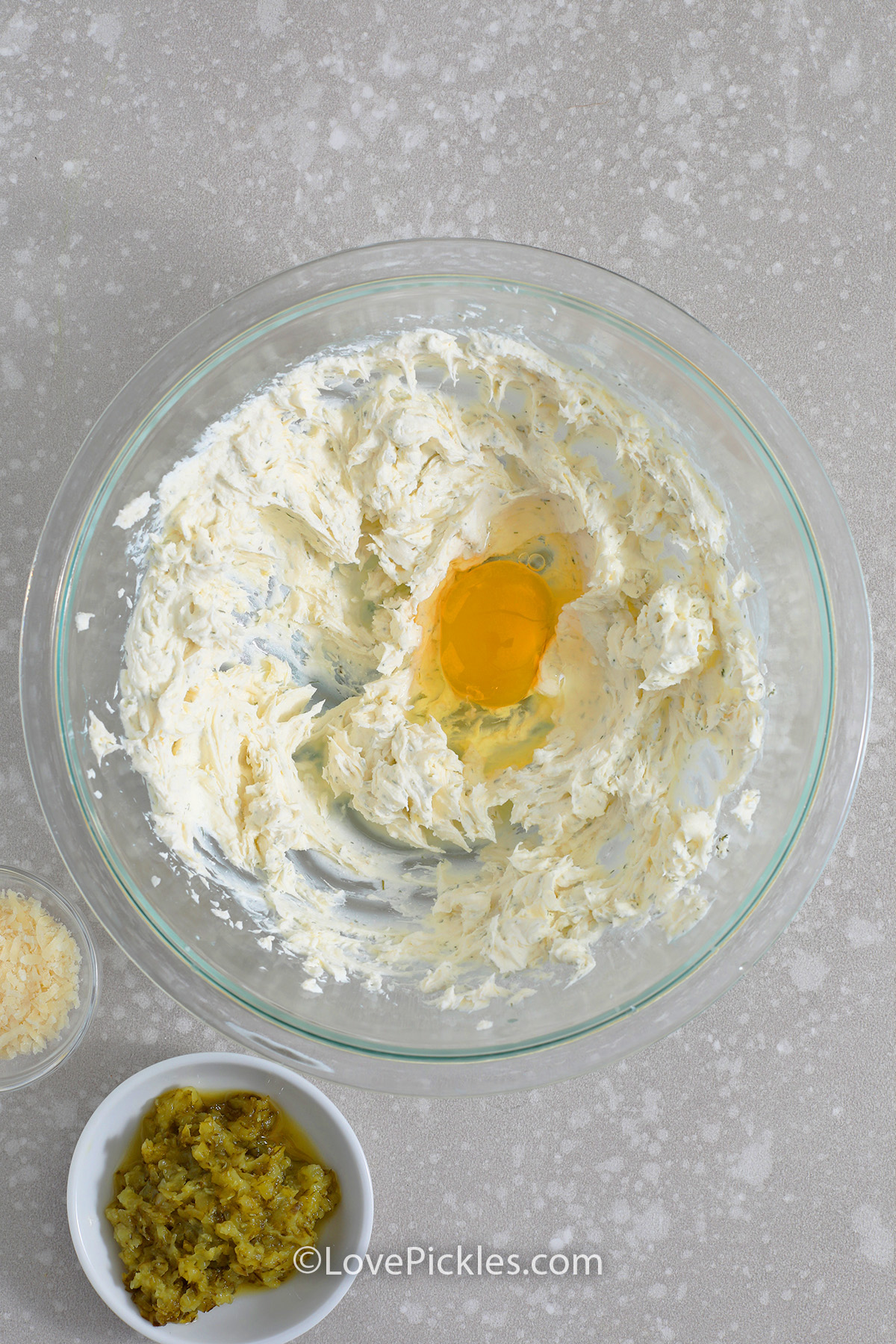 filling for savory dill pickle cheesecake appetizers being mixed in a bowl