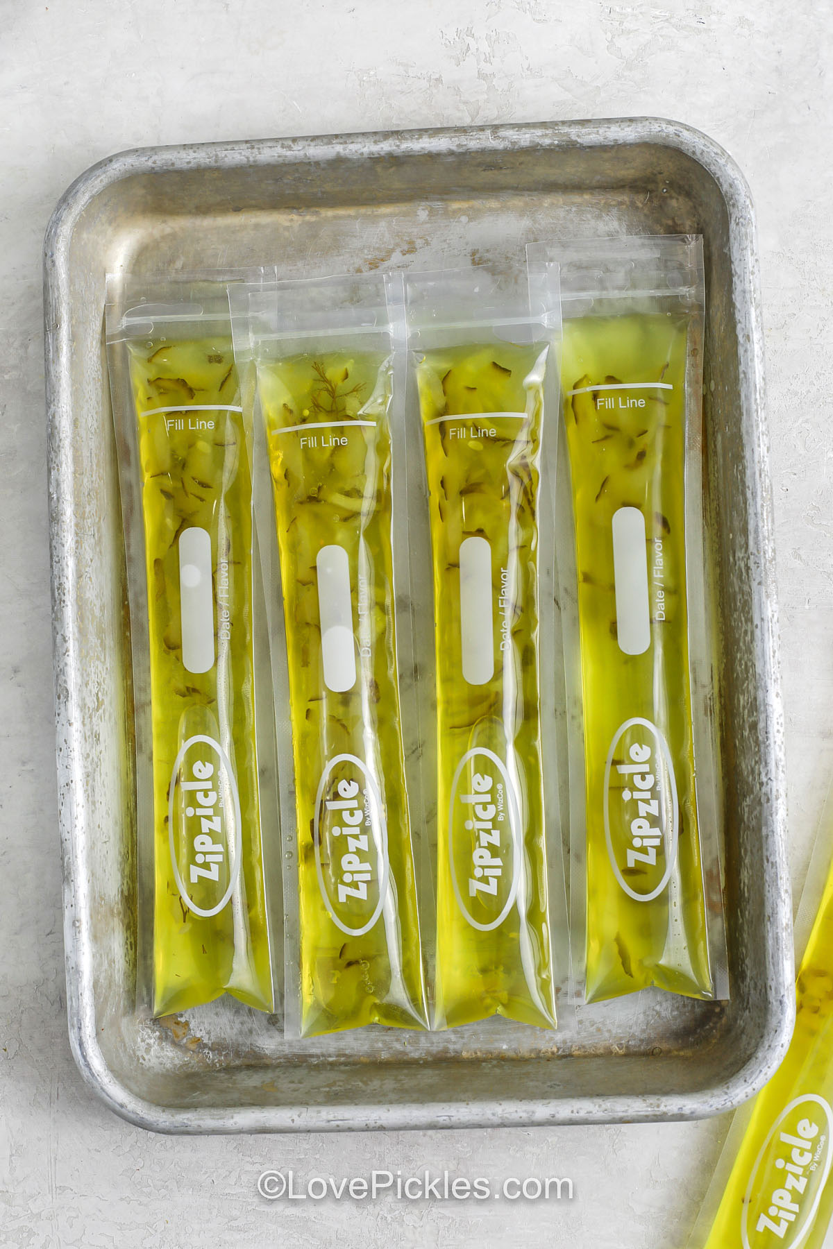 popsicle bags filled with the pickle popsicle mixture
