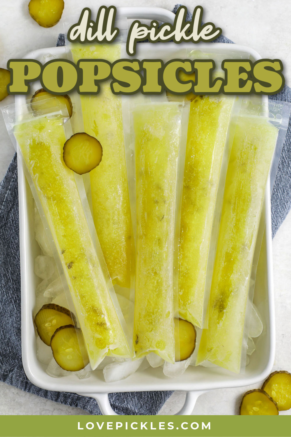 Dill PIckle Popsicles frozen on a tray with a title