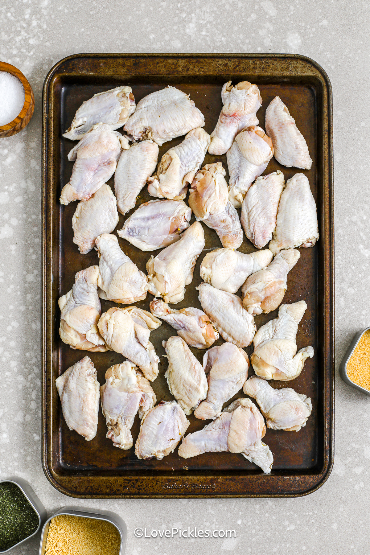 uncooked chicken wings on a tray